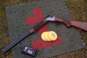 A Lasersport gun, clay and handset